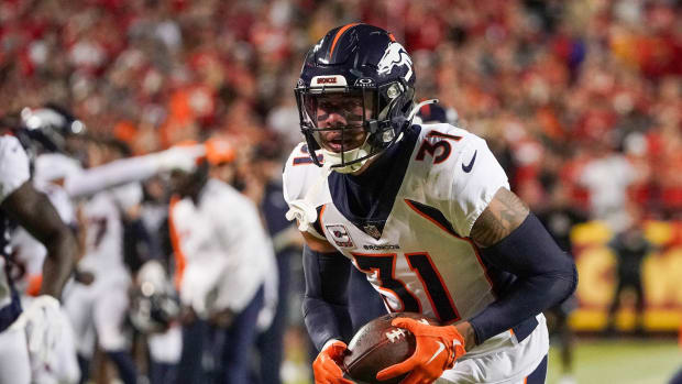 Oct 12, 2023; Kansas City, Missouri, USA; Denver Broncos safety Justin Simmons (31) runs the ball against the Kansas City Chiefs during the game at GEHA Field at Arrowhead Stadium. Mandatory Credit: Denny Medley-USA TODAY Sports  